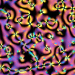 Photographie sous lumière polarisée d'un cristal liquide dans sa phase nématique